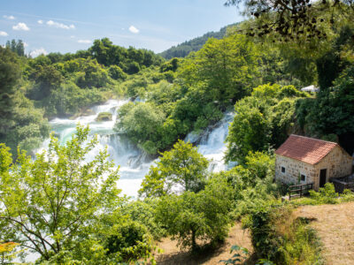 krka-waterfalls-house-in-greenery-scaled